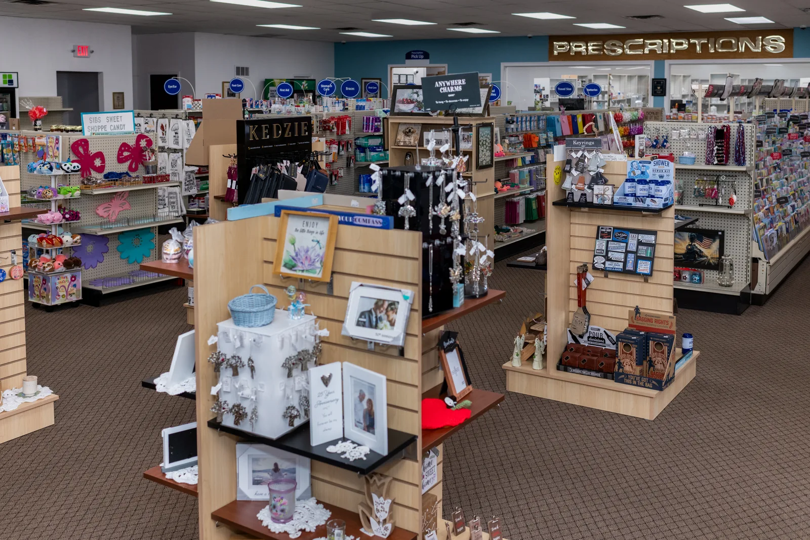 Gift displays, greeting cards, and health products inside New Stanton Pharmacy